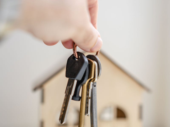 Person with keys for real estate
